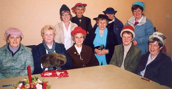 Mothers’ Union trying on hats!