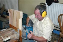 Billy Gallagher repairing the Tomregan pews