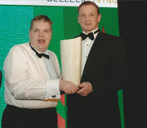 Joseph Wilson being presented with award